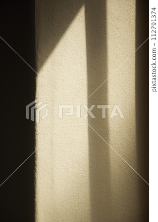 Comfortable rest by the sunny window. A background with sunlight and shadows that can be used in various designs. Comfortable rest by the sunny window. A background with sunlight and shadows that can be used in various designs. 112791374