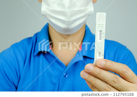 Man holding at Corona virus Antigen test kits (Covid 19) not infected with virus health and medicine concept Man holding at Corona virus Antigen test kits (Covid 19) not infected with virus health and medicine concept 112793188