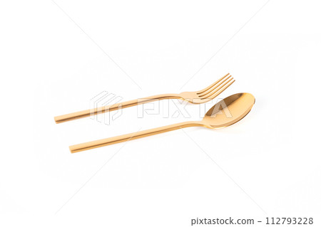 luxury golden stainless steel spoon and fork on white background luxury golden stainless steel spoon and fork on white background 112793228