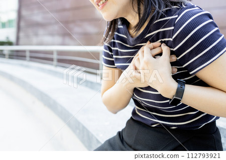 Tired middle aged woman with chest pain,shortness of breath,tightness in thorax,Symptoms of Pulmonary embolism similar to heart disease,obstruction of blood,a blood clot problem or coronary thrombosis Tired middle aged woman with chest pain,shortness of breath,tightness in thorax,Symptoms of Pulmonary embolism similar to heart disease,obstruction of blood,a blood clot problem or coronary thrombosis 112793921