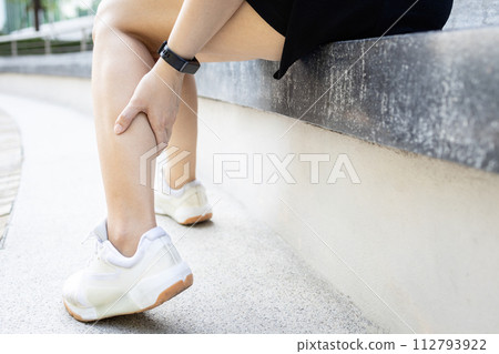 Asian woman have severe cramp her calf of leg,muscle strain,female massaging leg with her hands,suffering from muscular spasms and cramps,contraction of muscles or tendons,physical injury,health care Asian woman have severe cramp her calf of leg,muscle strain,female massaging leg with her hands,suffering from muscular spasms and cramps,contraction of muscles or tendons,physical injury,health care 112793922