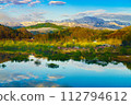 Lake Shirakawa with views of the Iide mountain range, submerged forest, and cherry blossoms 112794612