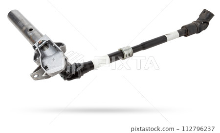 The spare part of the car is a metal steering propeller shaft with hinges on a white background with inscriptions designating the model. Repair of equipment at the auto-parsing in the workshop. 112796237
