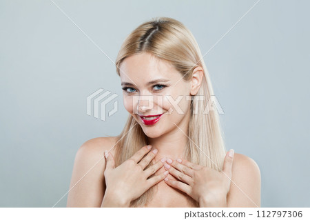 Excited fashion female model with long blonde hairstyle and shiny fresh skin Excited fashion female model with long blonde hairstyle and shiny fresh skin 112797306