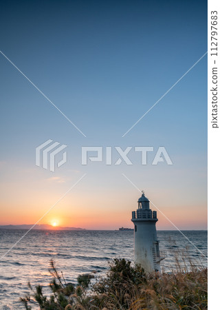 Sunset and lighthouse 112797683