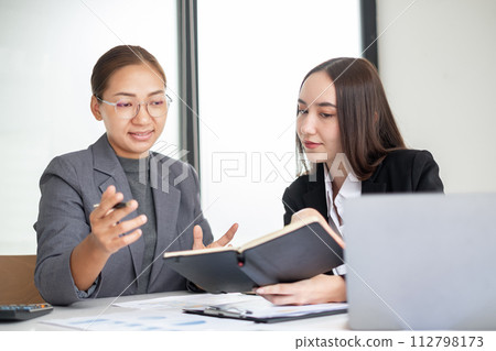 Business leaders talk about charts and finance graphs showing results are analyzing and calculating planning strategies, business success-building processes 112798173