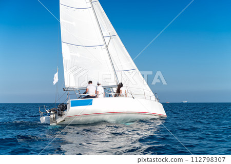 Crew in a yacht. Sailing yacht race regatta. Yachting sport 112798307