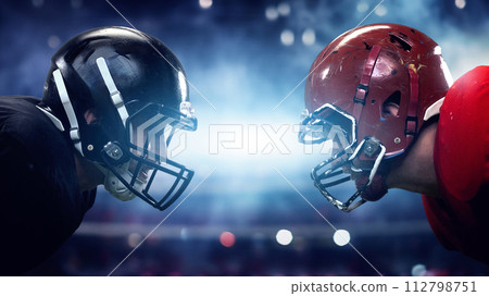Motivational poster emphasizing teamwork and competition in sports. Two American football players in helmets confronting each other 112798751