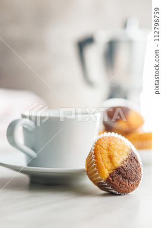 Close Up of a Muffin on a white Table 112798759