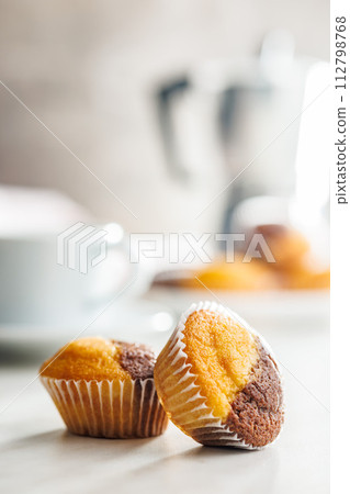 Close Up of a Muffin on a white Table Close Up of a Muffin on a white Table 112798768