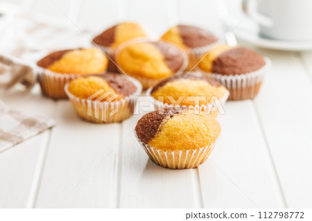 Close Up of a Muffin on a white Table Close Up of a Muffin on a white Table 112798772