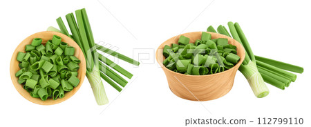 Green onion in wooden bowl isolated on the white background. Top view. Flat lay. Green onion in wooden bowl isolated on the white background. Top view. Flat lay. 112799110