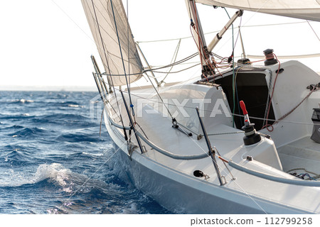 Close-up of sailing yacht in a rough sea Close-up of sailing yacht in a rough sea 112799258
