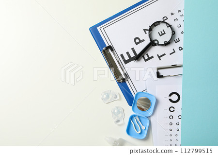 Contact lenses with accessories and a sight test plate 112799515