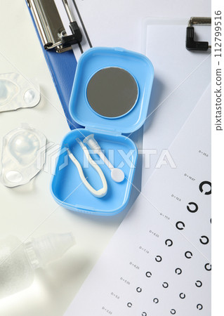 Contact lenses with accessories and a sight test plate 112799516