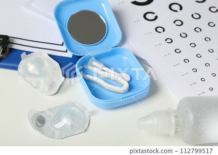 Contact lenses with accessories and a sight test plate 112799517