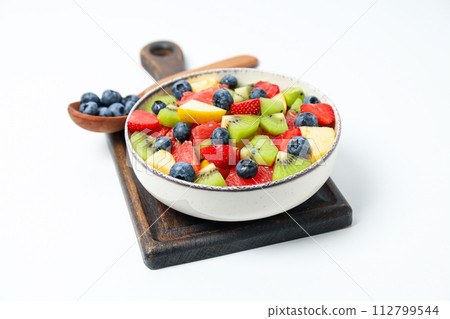Tasty and healthy nutrition concept - fruit salad Tasty and healthy nutrition concept - fruit salad 112799544