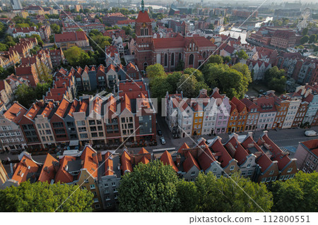 Beautiful panoramic architecture of old town in Gdansk, Poland at sunrise. Aerial view drone pov. Landscape cityscape City from Above. Small vintage historical buildings Europe Tourist Attractions Beautiful panoramic architecture of old town in Gdansk, Poland at sunrise. Aerial view drone pov. Landscape cityscape City from Above. Small vintage historical buildings Europe Tourist Attractions 112800551