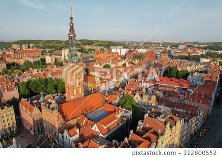St Mary's Cathedral Beautiful panoramic architecture of old town in Gdansk, Poland at sunrise. Aerial view drone pov. Landscape cityscape City from Above. Small vintage historical buildings Europe St Mary's Cathedral Beautiful panoramic architecture of old town in Gdansk, Poland at sunrise. Aerial view drone pov. Landscape cityscape City from Above. Small vintage historical buildings Europe 112800552