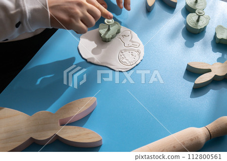 Workshop cutting figures Children air dry clay activity handicraft idea. DIY process step by step instruction. Preparing for Easter holiday decorating. Modern organic design minimalistic plastic free Workshop cutting figures Children air dry clay activity handicraft idea. DIY process step by step instruction. Preparing for Easter holiday decorating. Modern organic design minimalistic plastic free 112800561