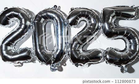 Happy new year 2025 metallic balloons on white background. Greeting card silver foil balloons numbers Christmas holiday concept. Celebration party congratulation 112800873