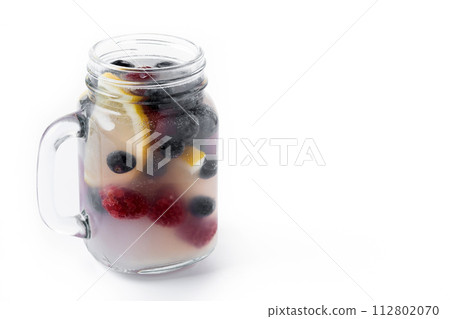 Fresh berry drink with blueberries and raspberries and lemon isolated on white background 112802070