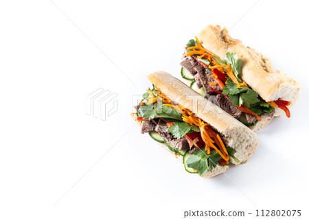 Vietnamese pork banh mi sandwich isolated on white background Vietnamese pork banh mi sandwich isolated on white background 112802075