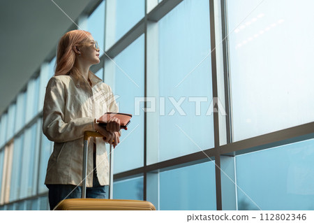 Airport travel and woman with passport, flight ticket or information of immigration, journey and luggage. identity document and international registration 112802346