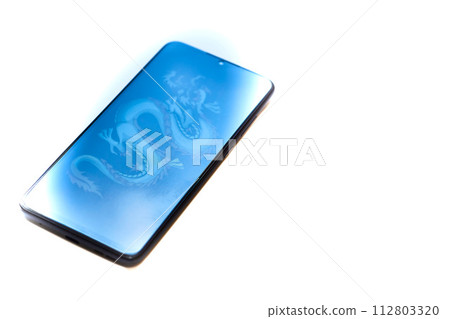 Mobile phone with eastern dragon screensaver on white 112803320