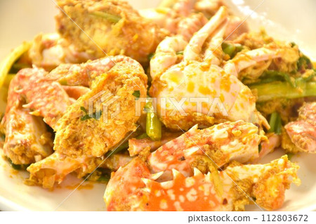 stir fried swimmer crab in yellow curry and egg on plate stir fried swimmer crab in yellow curry and egg on plate 112803672