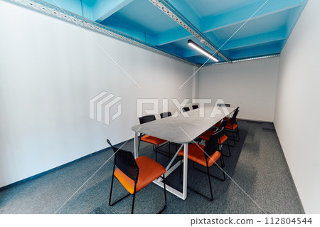 Photo of a modern office where programming, digital marketing and web design projects are done. Office with modern furniture and glass office 112804544