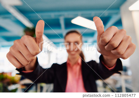 Closeup of hands, Smiling Business Woman Making Frame Gesture with at modern bright coworking open space startup office 112805477
