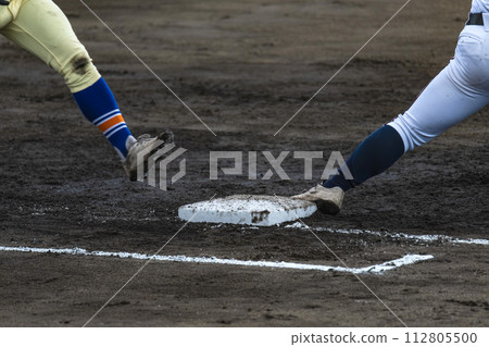 High school baseball game scene, sprinting to first base 112805500