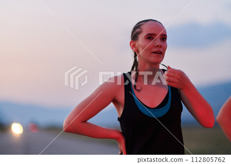 Close-Up Portrait of Determined Athlete Resting After Intense Workout 112805762