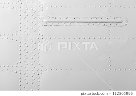 White industrial metal wall with rivets pattern, front view White industrial metal wall with rivets pattern, front view 112805996