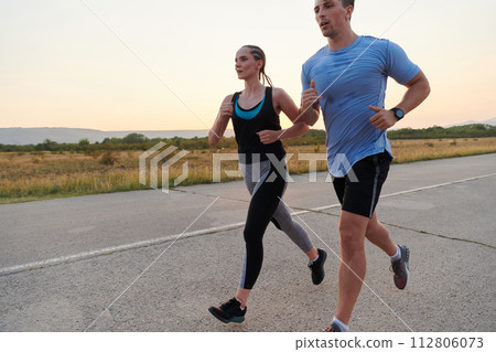 Dynamic Duo: Fitness-Ready Couple Embraces Confidence and Preparation for Upcoming Marathons Dynamic Duo: Fitness-Ready Couple Embraces Confidence and Preparation for Upcoming Marathons 112806073