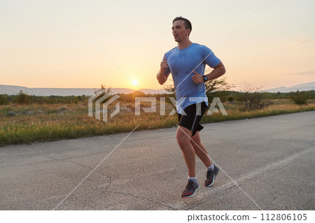 A dedicated marathon runner pushes himself to the limit in training. 112806105
