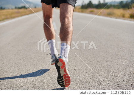 Athletic young man running in the nature. Healthy lifestyle. 112806135