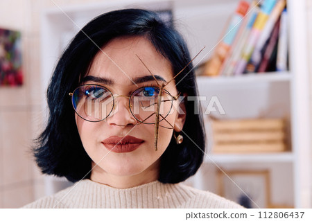 Young Woman Captured in a Beautiful Moment with Her Stick Insect (Medauroidea Extradentata) 112806437