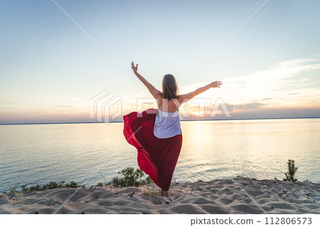 Woman staying at the sea Woman staying at the sea 112806573