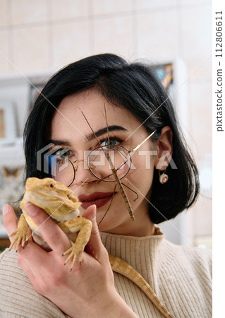 Woamn and Her Pets: A Bearded Dragon and a Stick Insect 112806611