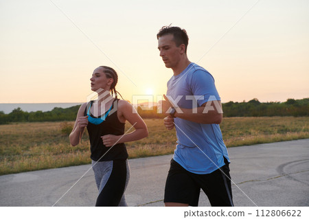 Dynamic Duo: Fitness-Ready Couple Embraces Confidence and Preparation for Upcoming Marathons Dynamic Duo: Fitness-Ready Couple Embraces Confidence and Preparation for Upcoming Marathons 112806622