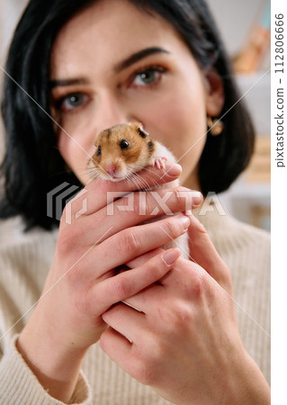 A Black-Haired Beauty Enjoys a Cozy Day at Home with Her Pet Mouse A Black-Haired Beauty Enjoys a Cozy Day at Home with Her Pet Mouse 112806666