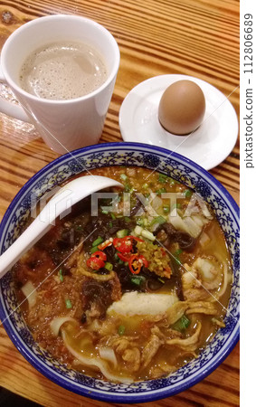 A classic meal of tea, eggs and a bowl of noodles A classic meal of tea, eggs and a bowl of noodles 112806689
