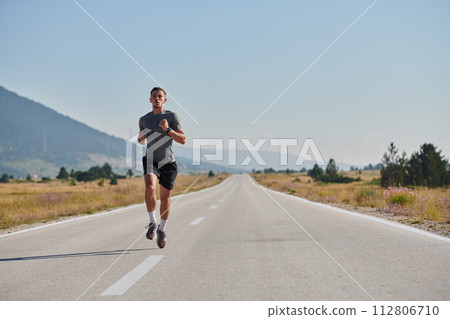 A dedicated marathon runner pushes himself to the limit in training. 112806710