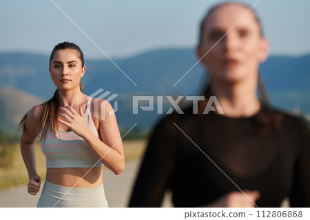 A determined woman athlete trains for success in the morning sun. 112806868