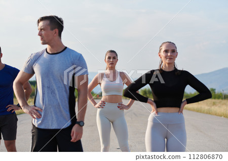 Diverse Athletic Warm-Up: Group Prepares for Intense Running Challenge. Diverse Athletic Warm-Up: Group Prepares for Intense Running Challenge. 112806870