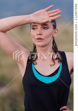 Close-Up Portrait of Determined Athlete Resting After Intense Workout Close-Up Portrait of Determined Athlete Resting After Intense Workout 112807046