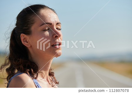 Close-Up Portrait of Determined Athlete Resting After Intense Workout 112807078
