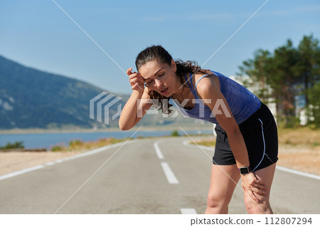Close-Up Portrait of Determined Athlete Resting After Intense Workout 112807294
